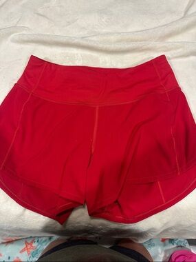 Lululemon red shorts 4” inseam 4 tall
GUC / EUC inside pull elastic